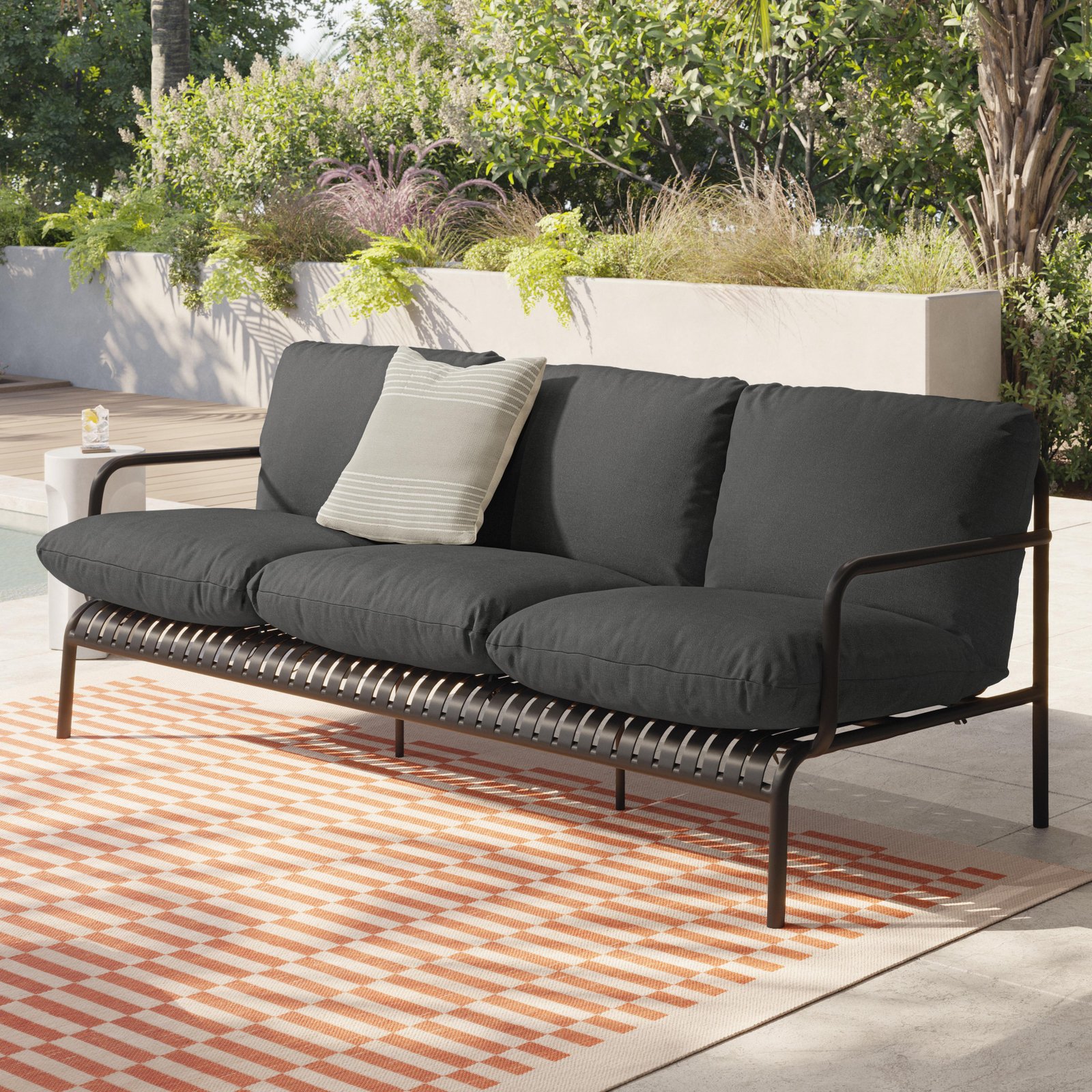 Outdoor sofa upholstered in performance fabric